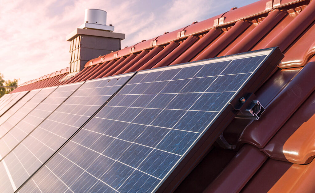 Photovoltaic solar panel on roof of house, solar electricity